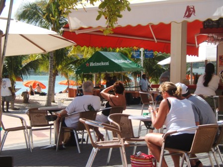 Sitting in an outdoor cafe looking over the boardwalk and beach in Philipsburgh, St Maarten